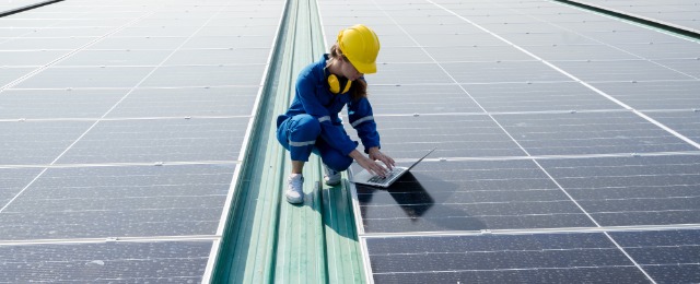 Engineer service check installation solar cell on the roof of factory